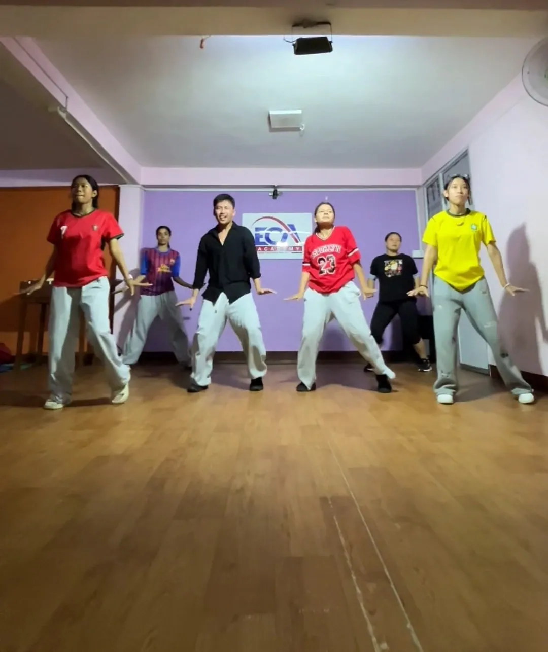 A group dance class in the ECA Academy hall