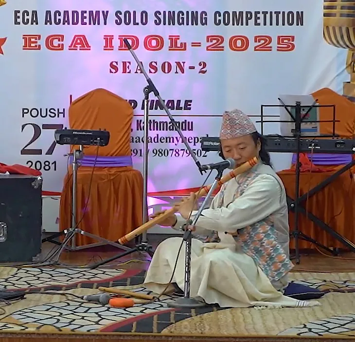 Guru Nagendra Bikram Rai playing bansuri at the ECA Idol 2025 grand finale