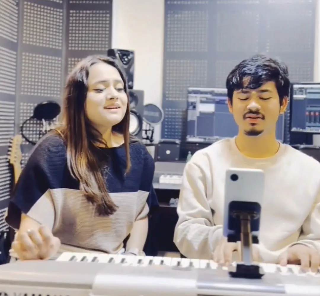 Students playing keyboard and singing in the ECA studio