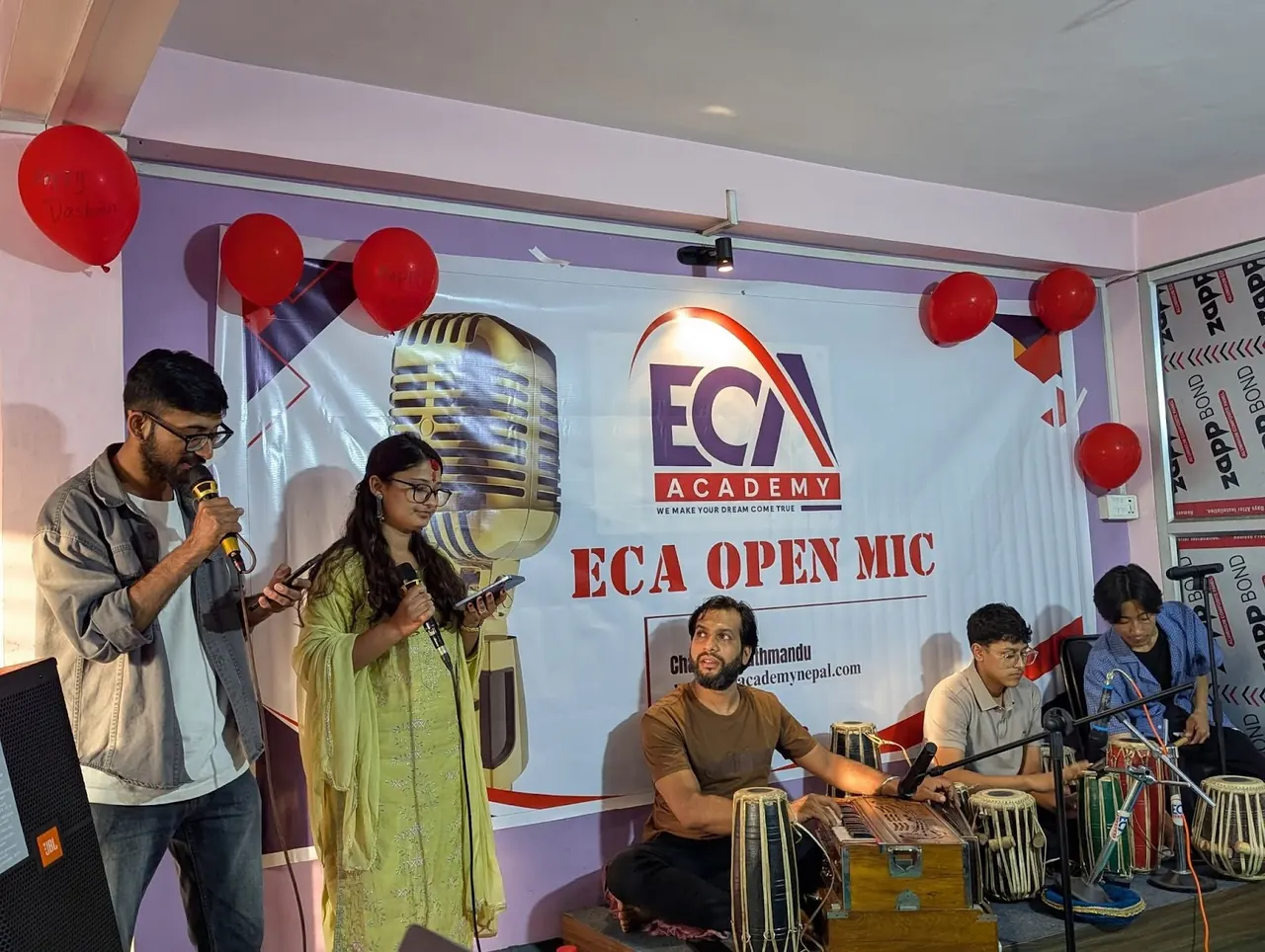 Two students singing with tabla at ECA Open Mic